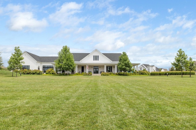 view of front of home featuring a porch and a front lawn