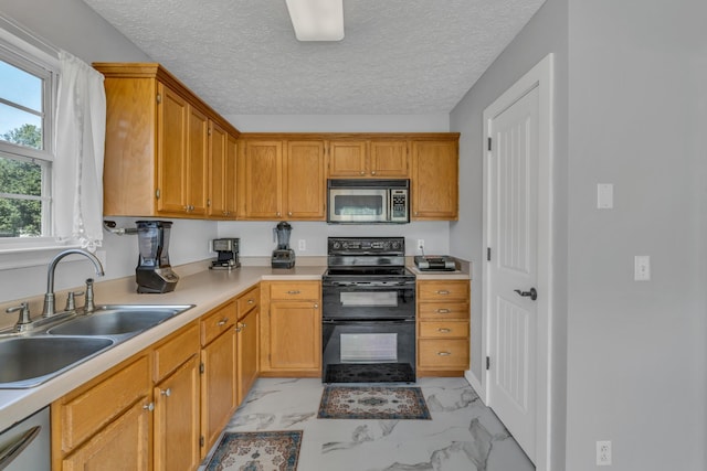 kitchen featuring marble finish floor, stainless steel microwave, a sink, black range with electric cooktop, and dishwasher