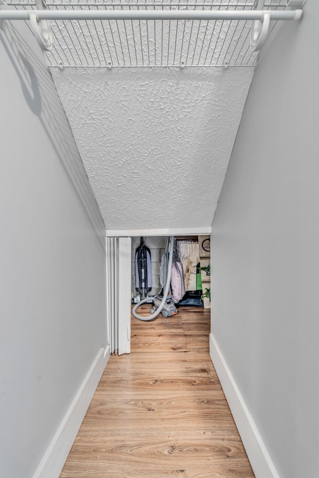 spacious closet with wood finished floors