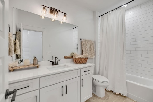 full bath with toilet, shower / tub combo with curtain, and vanity