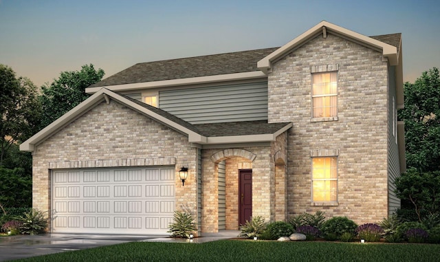 view of front of home with driveway, brick siding, and an attached garage