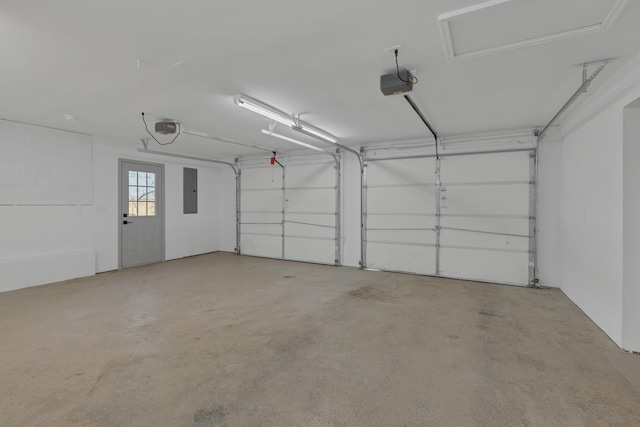 garage with electric panel and a garage door opener