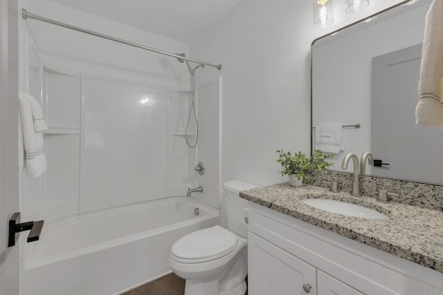 bathroom with shower / washtub combination, vanity, and toilet