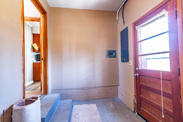 entrance foyer featuring electric panel and concrete flooring