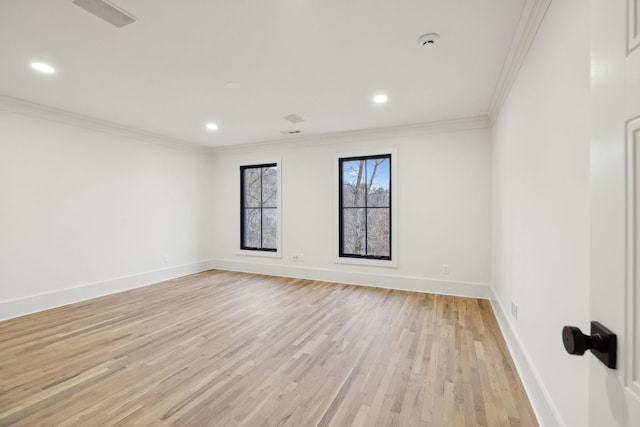 unfurnished room with baseboards, light wood finished floors, recessed lighting, and crown molding