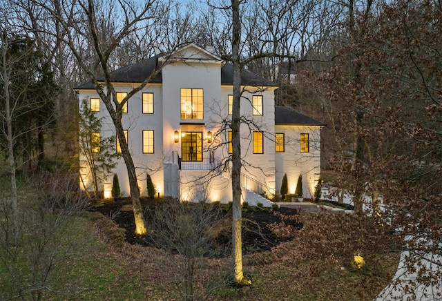 view of side of property with stucco siding