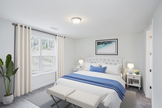 carpeted bedroom with visible vents and baseboards