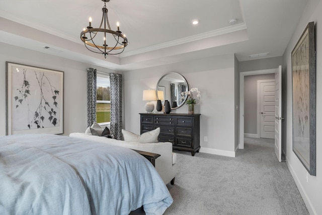 bedroom featuring carpet flooring, baseboards, ornamental molding, a tray ceiling, and an inviting chandelier