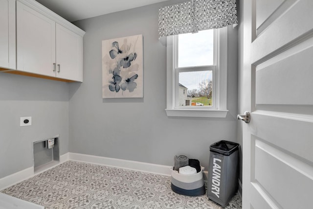 laundry area with baseboards, tile patterned floors, cabinet space, and electric dryer hookup