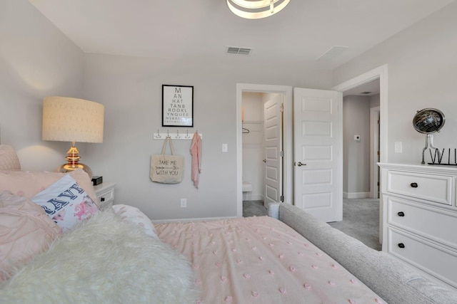 carpeted bedroom with visible vents and baseboards