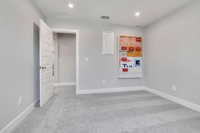 unfurnished bedroom with electric panel, visible vents, baseboards, carpet floors, and recessed lighting