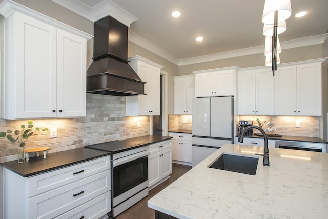 kitchen with a sink, ornamental molding, custom exhaust hood, freestanding refrigerator, and electric range oven