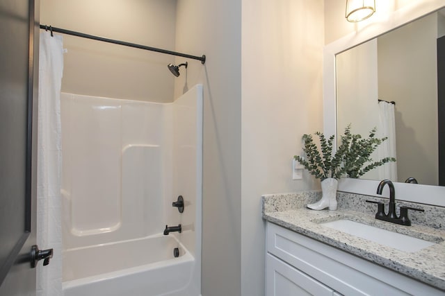 bathroom with shower / bathtub combination with curtain and vanity