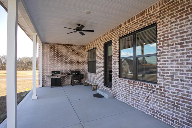 view of patio featuring ceiling fan and a grill