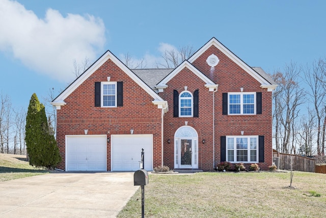 view of front of house featuring a garage, brick siding, fence, driveway, and a front yard