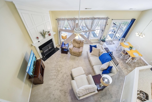 living room featuring a fireplace with flush hearth, carpet flooring, visible vents, and baseboards