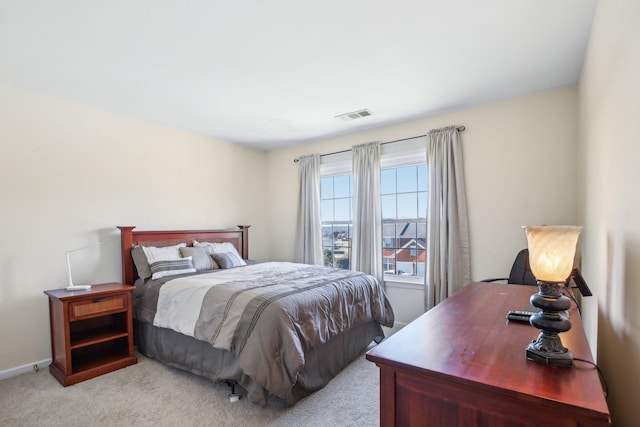 bedroom with light carpet, baseboards, and visible vents