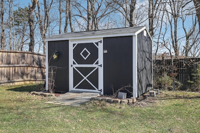 view of shed featuring a fenced backyard