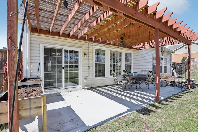 view of patio / terrace with fence, a ceiling fan, and a pergola