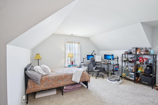 carpeted bedroom with lofted ceiling and visible vents