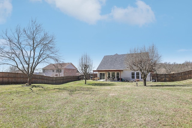 view of yard featuring a patio area and a fenced backyard