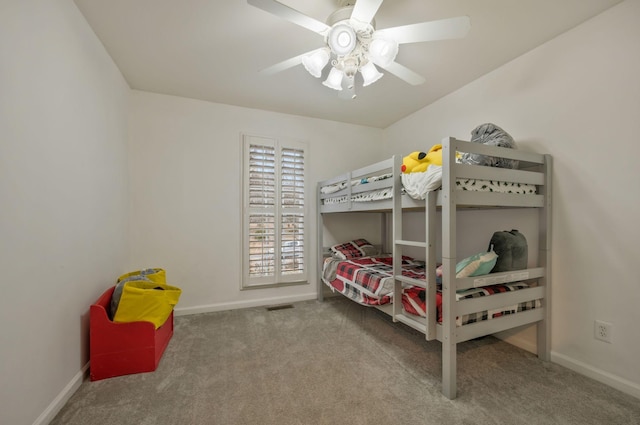 carpeted bedroom featuring visible vents, ceiling fan, and baseboards