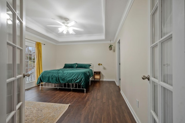 bedroom featuring ceiling fan, wood finished floors, baseboards, french doors, and crown molding