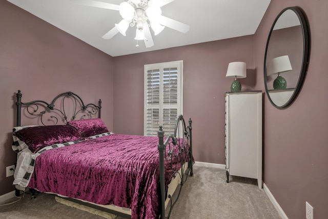 bedroom featuring a ceiling fan, baseboards, and carpet flooring