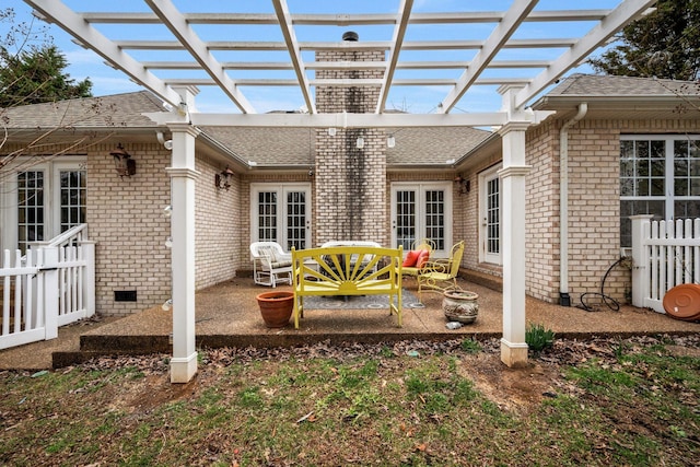 view of patio / terrace featuring fence, a pergola, and french doors