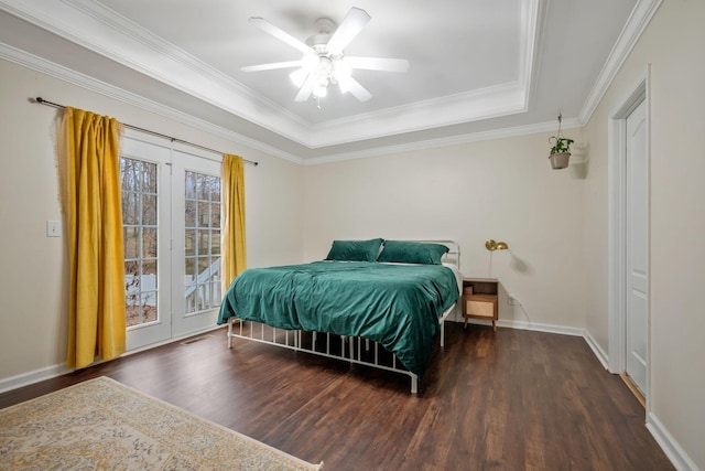 bedroom with wood finished floors, visible vents, baseboards, access to outside, and ornamental molding