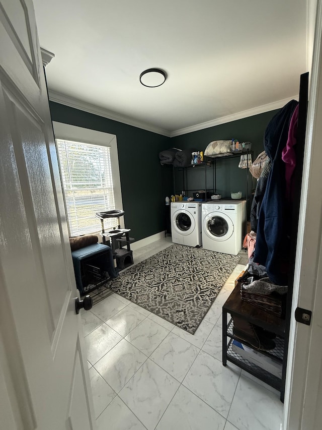 laundry room featuring marble finish floor, crown molding, separate washer and dryer, laundry area, and baseboards