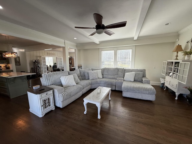 living room with dark wood-style flooring, beamed ceiling, and plenty of natural light