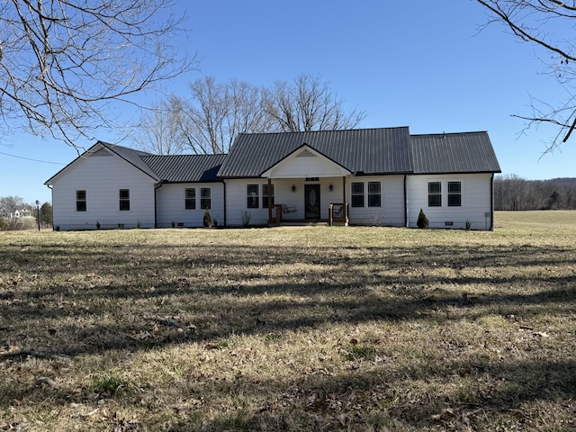 single story home with crawl space, metal roof, and a front yard