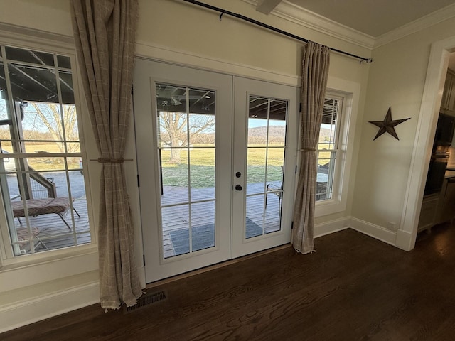 entryway featuring dark wood-style floors, french doors, visible vents, ornamental molding, and baseboards