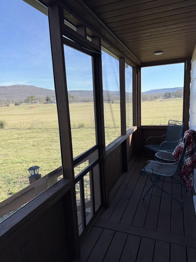 sunroom / solarium with a rural view