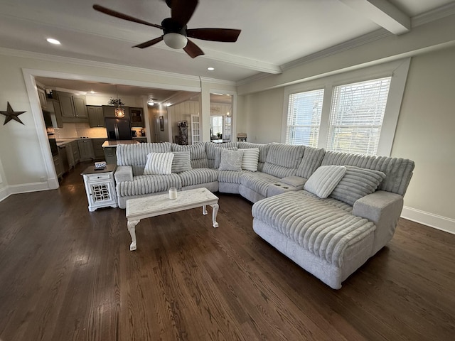 living area with beam ceiling, dark wood finished floors, and baseboards