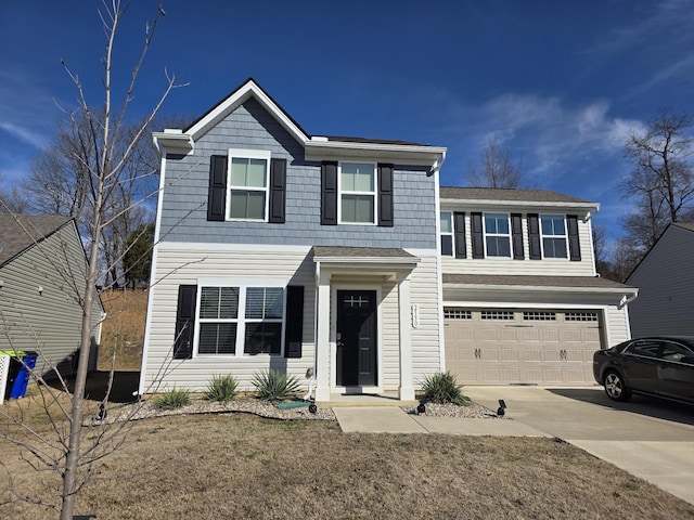 traditional-style home with driveway and an attached garage