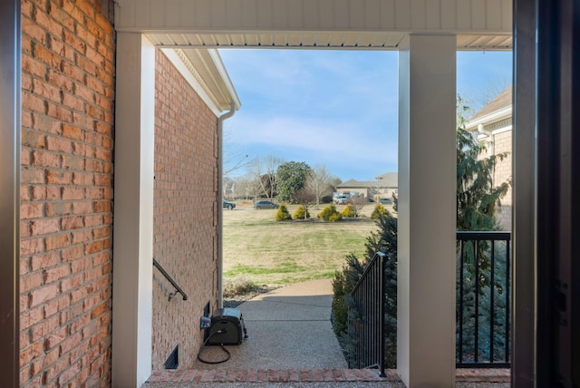 entryway with brick wall