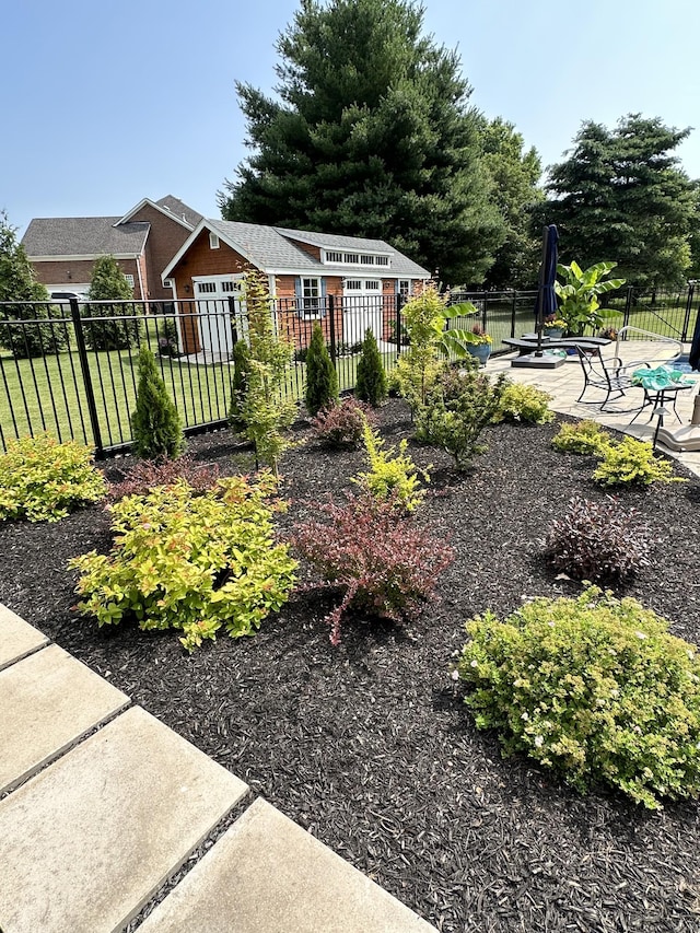 view of yard with a patio area and a fenced front yard