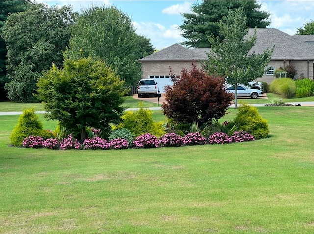 view of yard with a garage