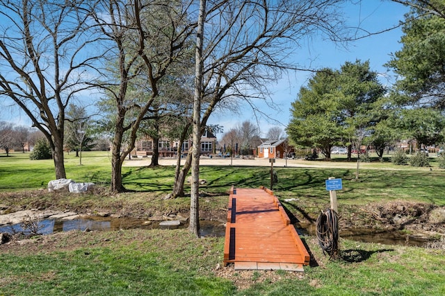 surrounding community featuring a lawn