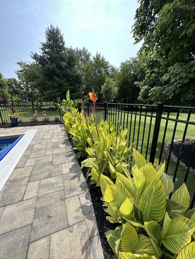 view of patio / terrace featuring fence