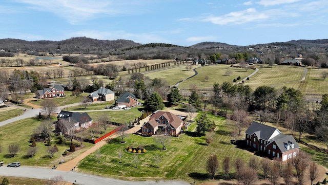 birds eye view of property with a rural view and a mountain view