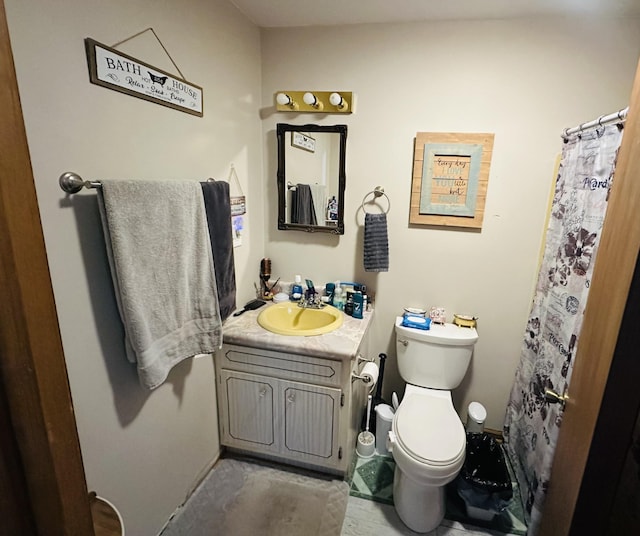 full bathroom featuring toilet and vanity