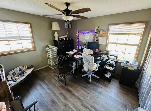 office area featuring a textured ceiling, ceiling fan, wood finished floors, and baseboards