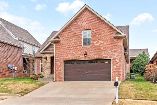 traditional-style house featuring concrete driveway, brick siding, and a front yard