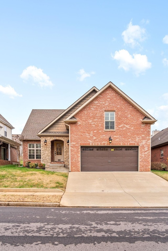 view of front of property featuring concrete driveway, brick siding, stone siding, and a front yard