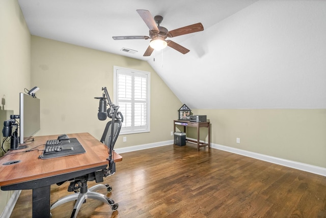 office area with visible vents, ceiling fan, vaulted ceiling, wood finished floors, and baseboards