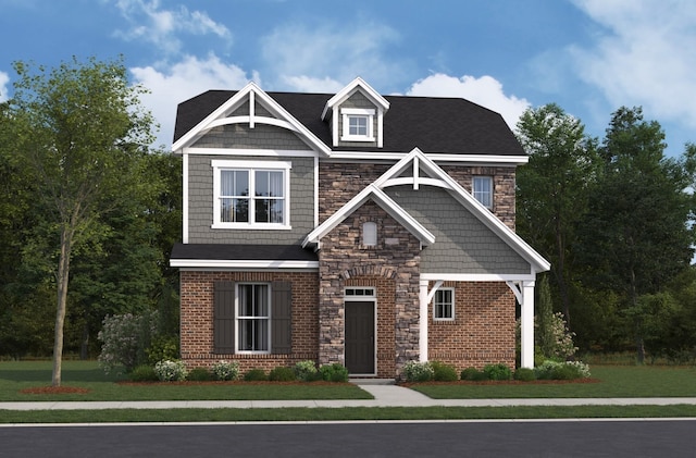 view of front of property featuring a front yard, stone siding, and brick siding