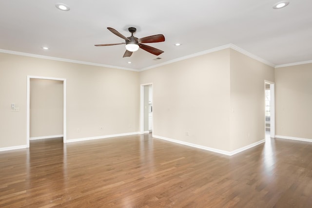 empty room featuring baseboards and wood finished floors